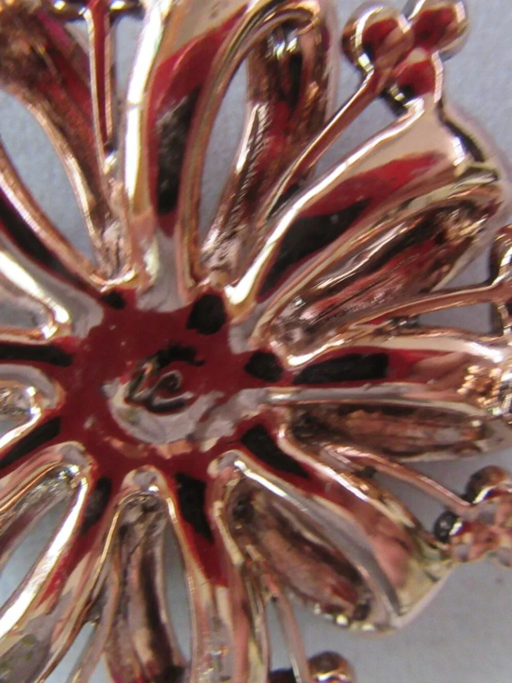 Liz Claiborne copper ribbon brooch with red & pink rhinestones